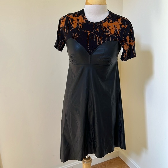 Zara Dresses & Skirts - Zara medium black faux leather short sleeve asymmetrical dress.